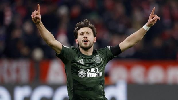 Soccer Football - Champions League - Knockout Phase Playoff - Second Leg - Bayern Munich v Celtic - Allianz Arena, Munich, Germany - February 18, 2025 Celtic's Nicolas Gerrit Kuhn celebrates scoring their first goal REUTERS/Michaela Stache